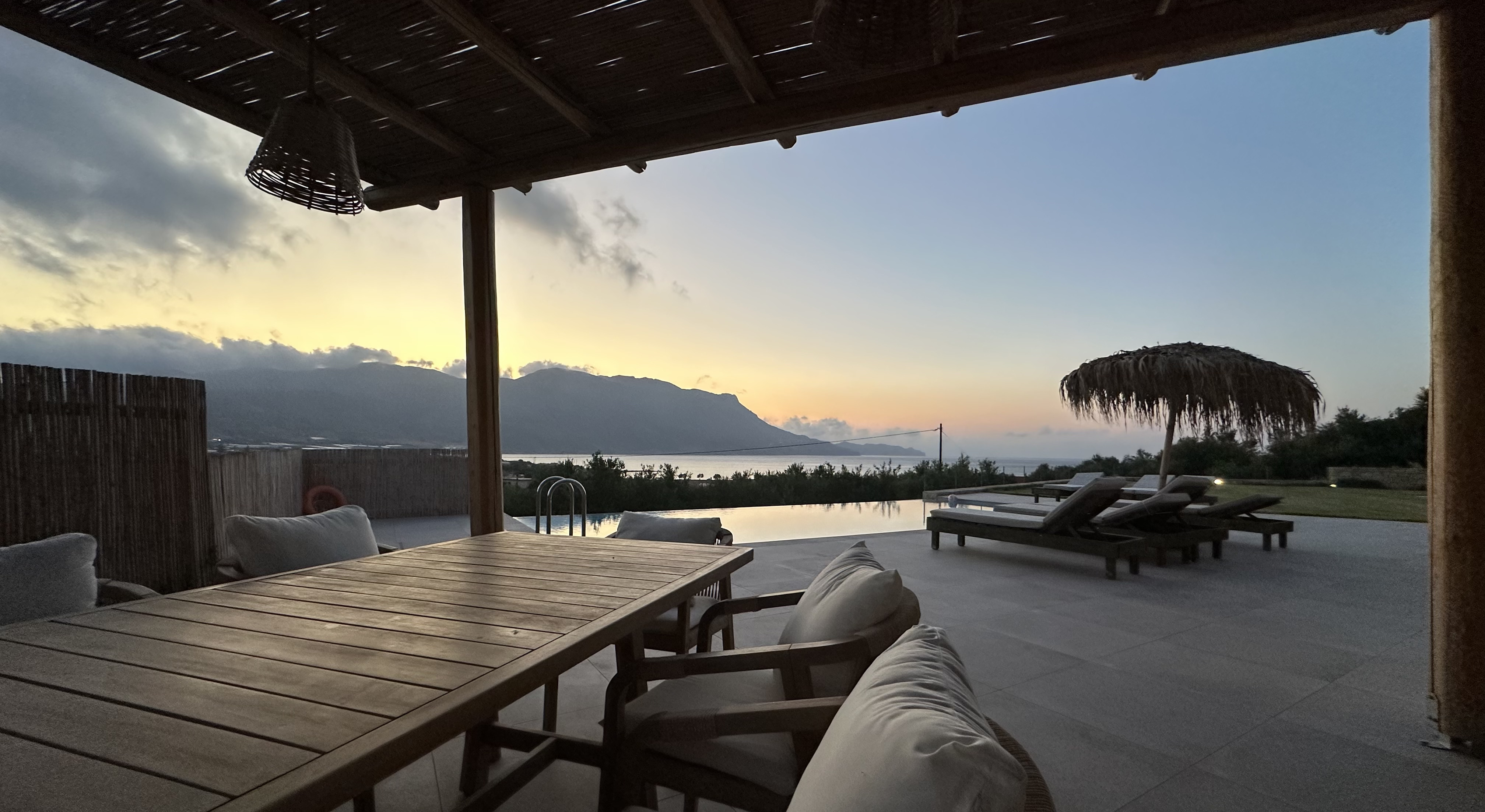 NUSA Falasarna infinity-pool villa interior and terrace details