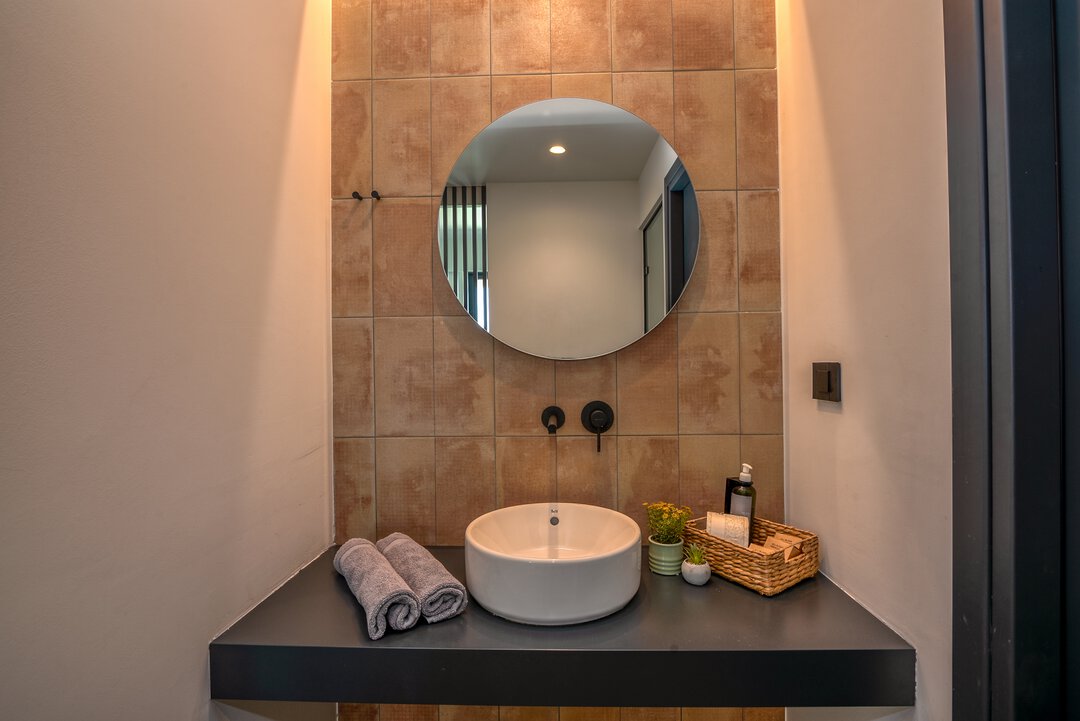 Minimalist open wardrobe with built-in bench at Nusa Balos villa, Crete