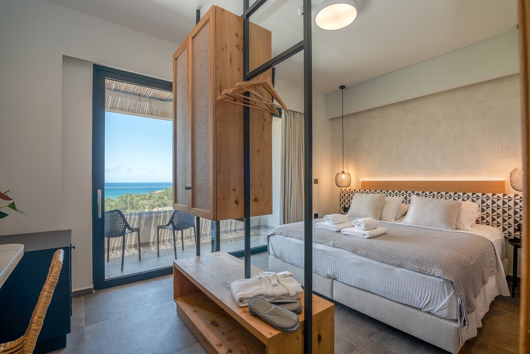 Luxury bathroom with dual-tone tiles and rainfall shower at Nusa Balos near Balos Lagoon, Crete