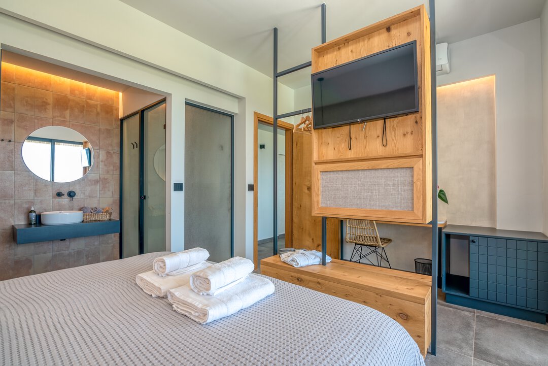 Elegant guest bedroom with a warm neutral palette at Nusa Balos villa, Crete