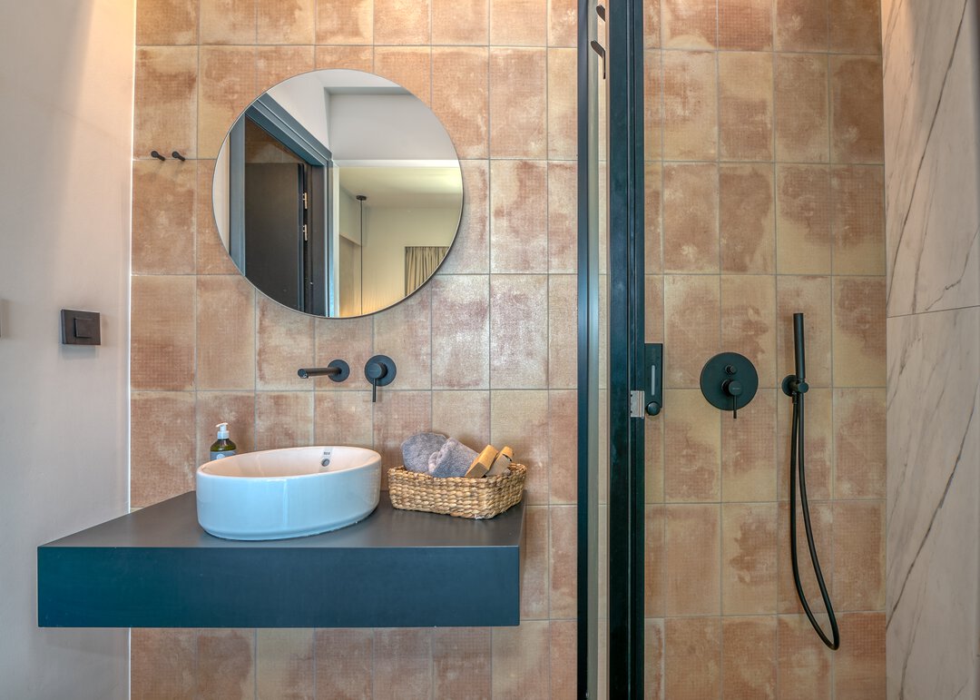 Spa-inspired bathroom with modern finishes at Nusa Balos villa, Crete