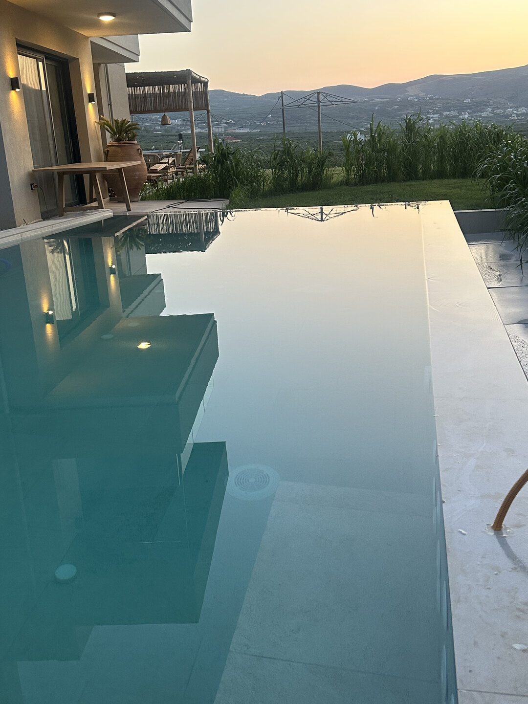 NUSA Balos outdoor terraces, pool, and pergola spaces