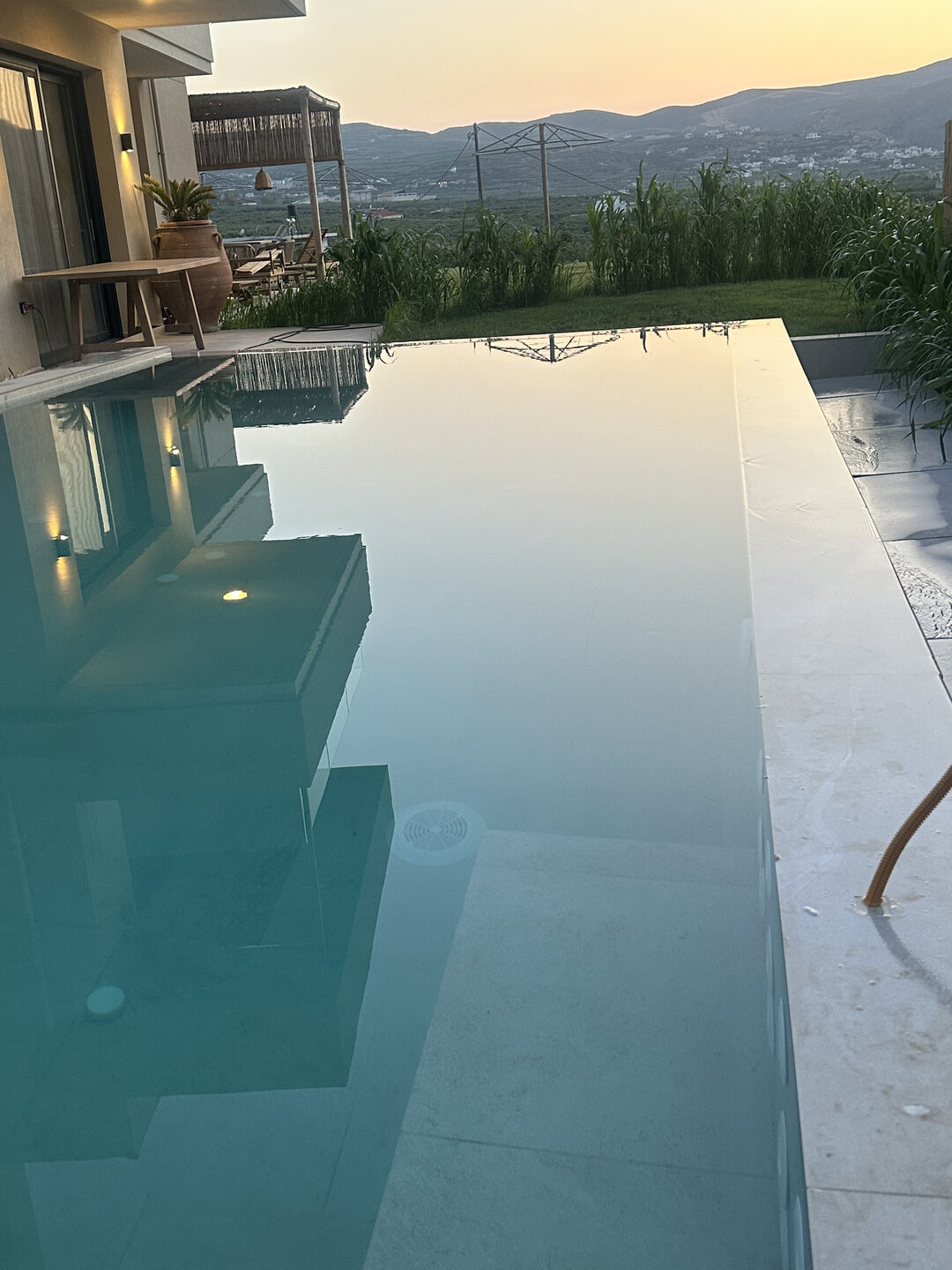 NUSA Balos outdoor terraces, pool, and pergola spaces