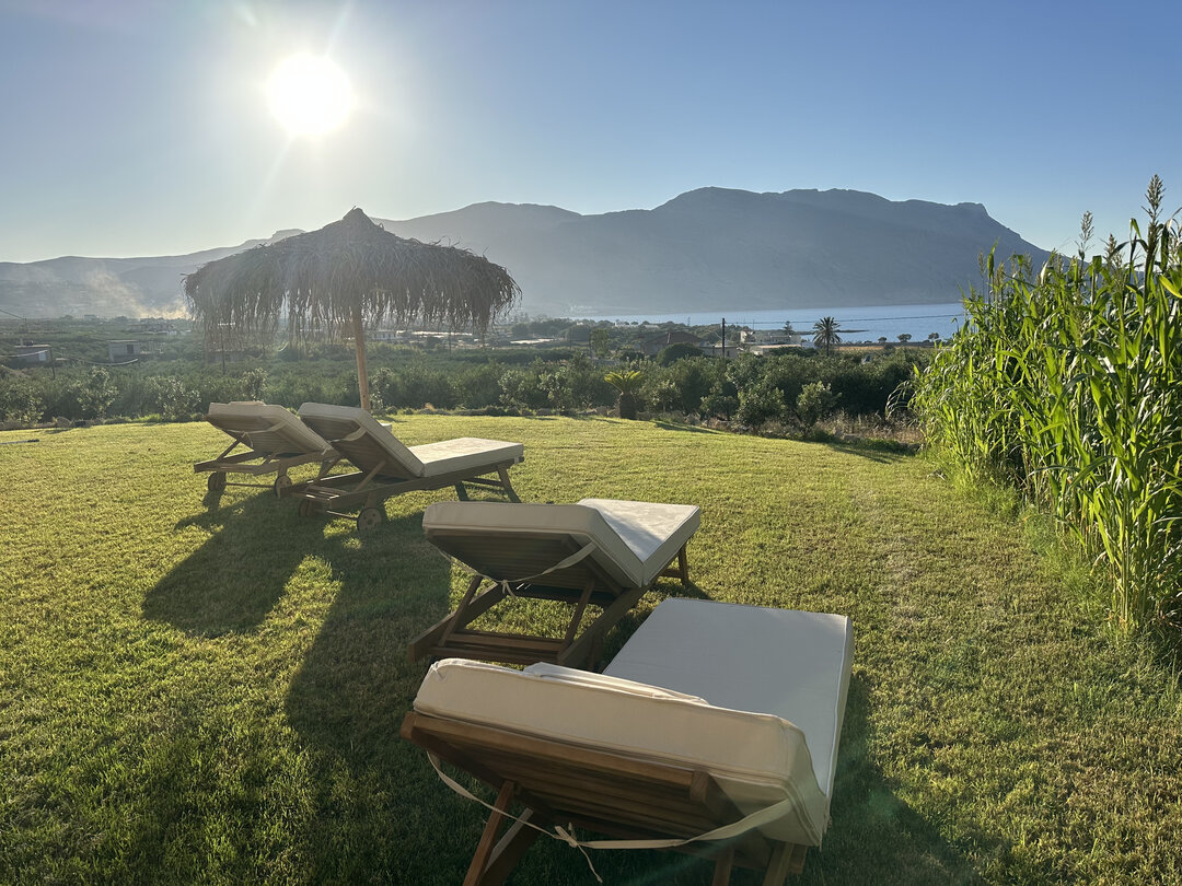 NUSA Balos outdoor terraces, pool, and pergola spaces