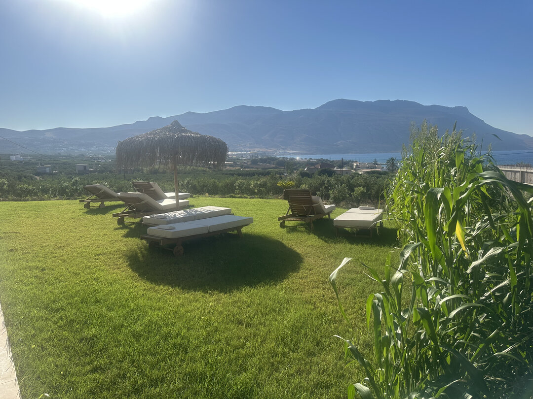 NUSA Balos outdoor terraces, pool, and pergola spaces